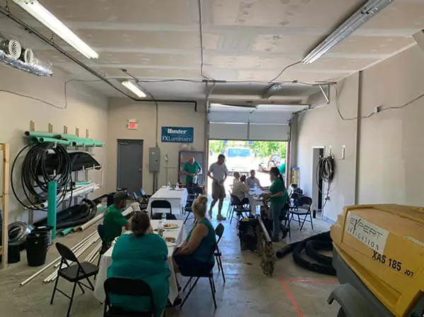 Expert Irrigation & Outdoor Lighting Staff sitting in a room