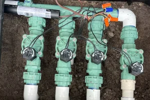 Sprinkler system valves and wiring setup for irrigation timer maintenance and water flow control in Cincinnati lawns