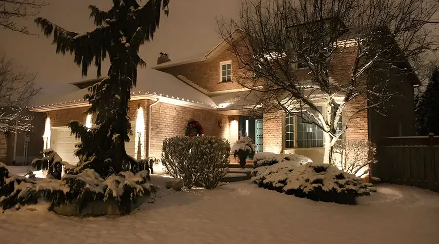 Weather-resistant outdoor lighting illuminating a snow-covered home in Northern Kentucky winter