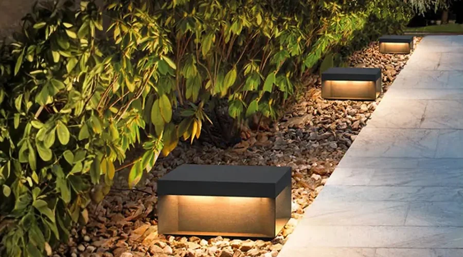 Low-voltage pathway lighting installed along a landscaped walkway in Northern Kentucky, showing energy-efficient outdoor lighting for winter safety and curb appeal.