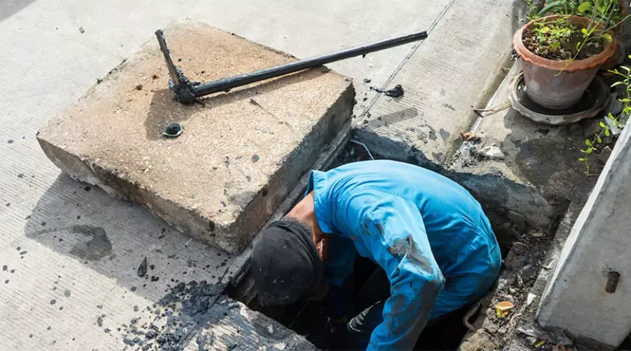 A drainage contractor performing annual maintenance to prevent hidden dangers in Cincinnati