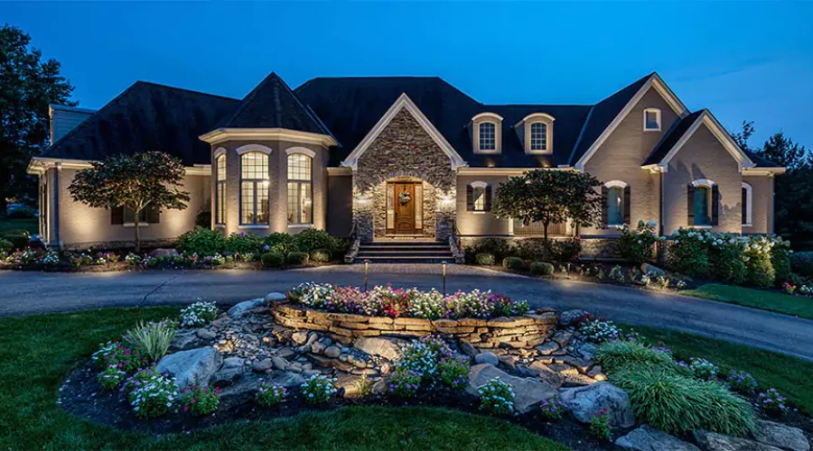 Beautifully lit home exterior with professional landscape lighting in Cincinnati, OH