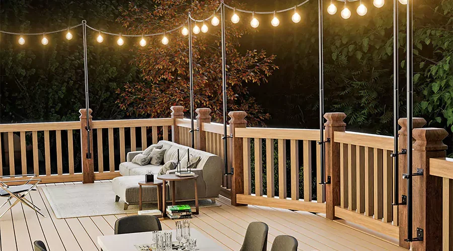 Stylish outdoor deck with hanging string lights, cozy seating area, and dining table, creating a warm and inviting ambiance for outdoor gatherings.