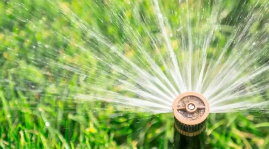 Efficient sprinkler system watering lawn for Cincinnati homeowners using water-saving irrigation methods