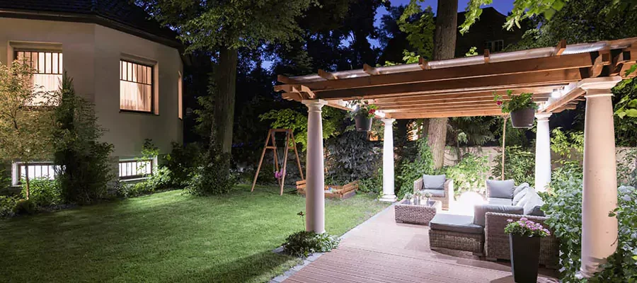 Deck & Patio Lighting with a house and big trees