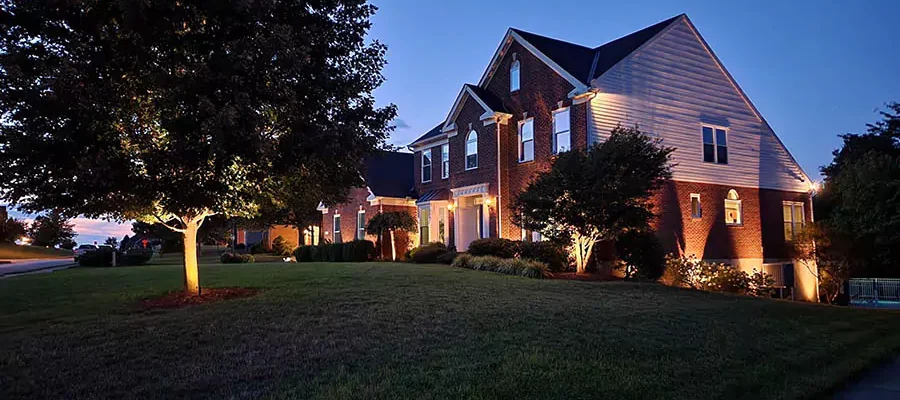 In Front of a Independence house, outdoor landscape lighting installed by Expert Irrigation