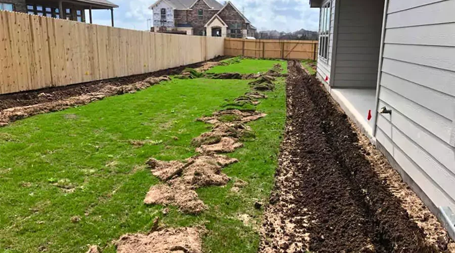 Working on irrigation system in a lawn