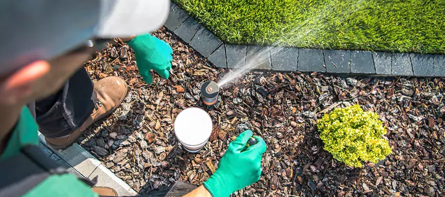 Expert Irrigation staff repair sprinkler system