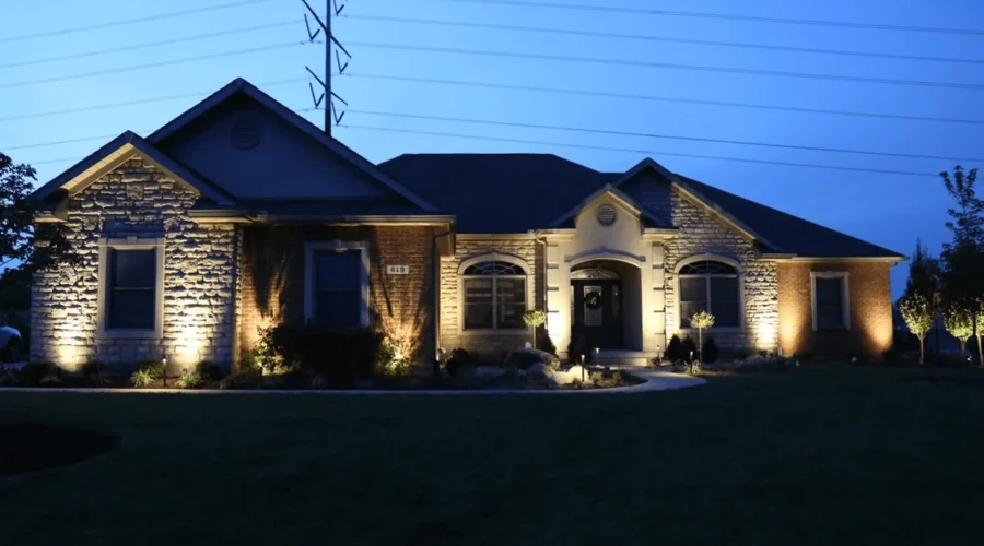 Installed outdoor landscape lighting in a beautiful house by Expert irrigation team members in Cincinnati, OH